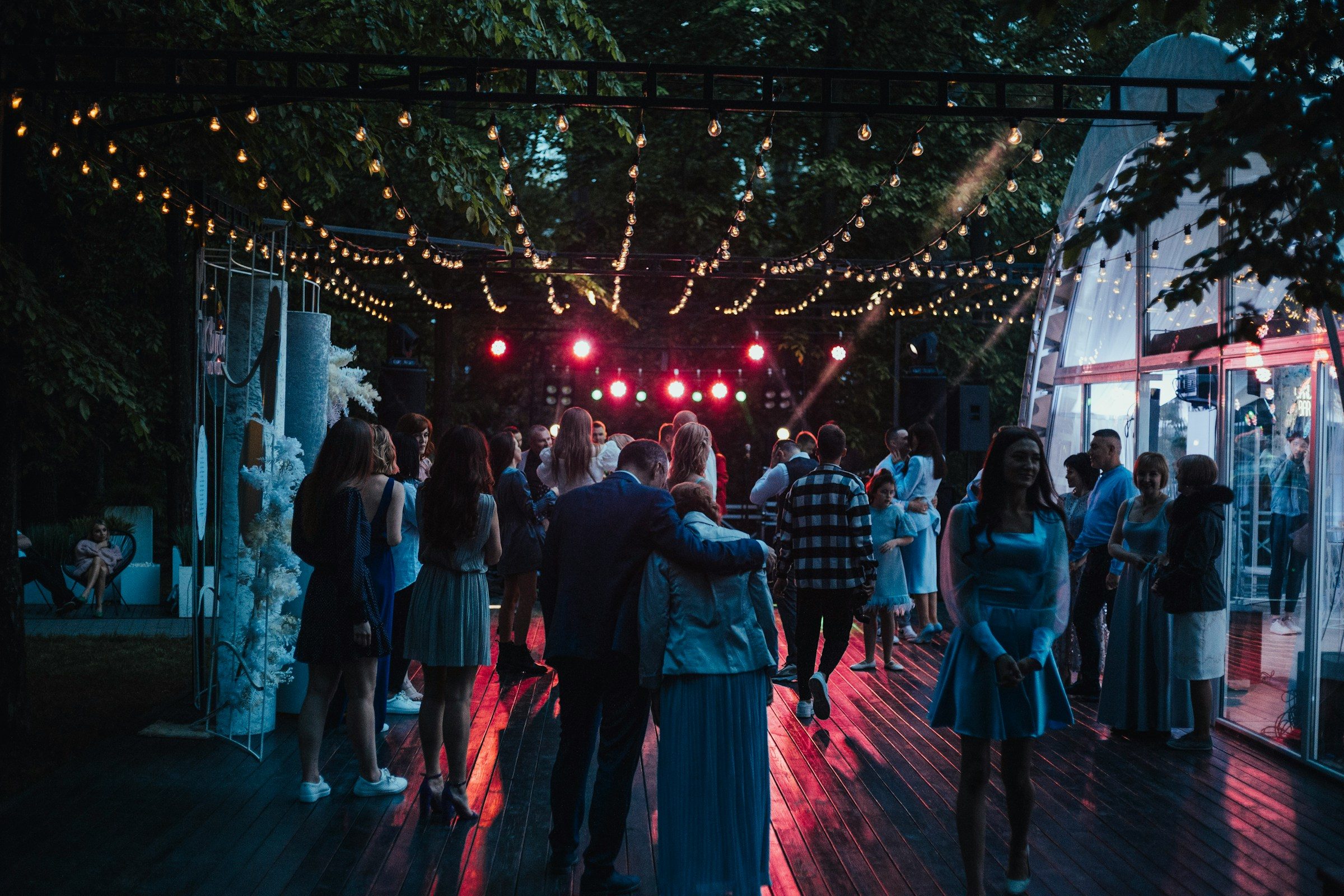 A couple sharing a first dance in warm evening light