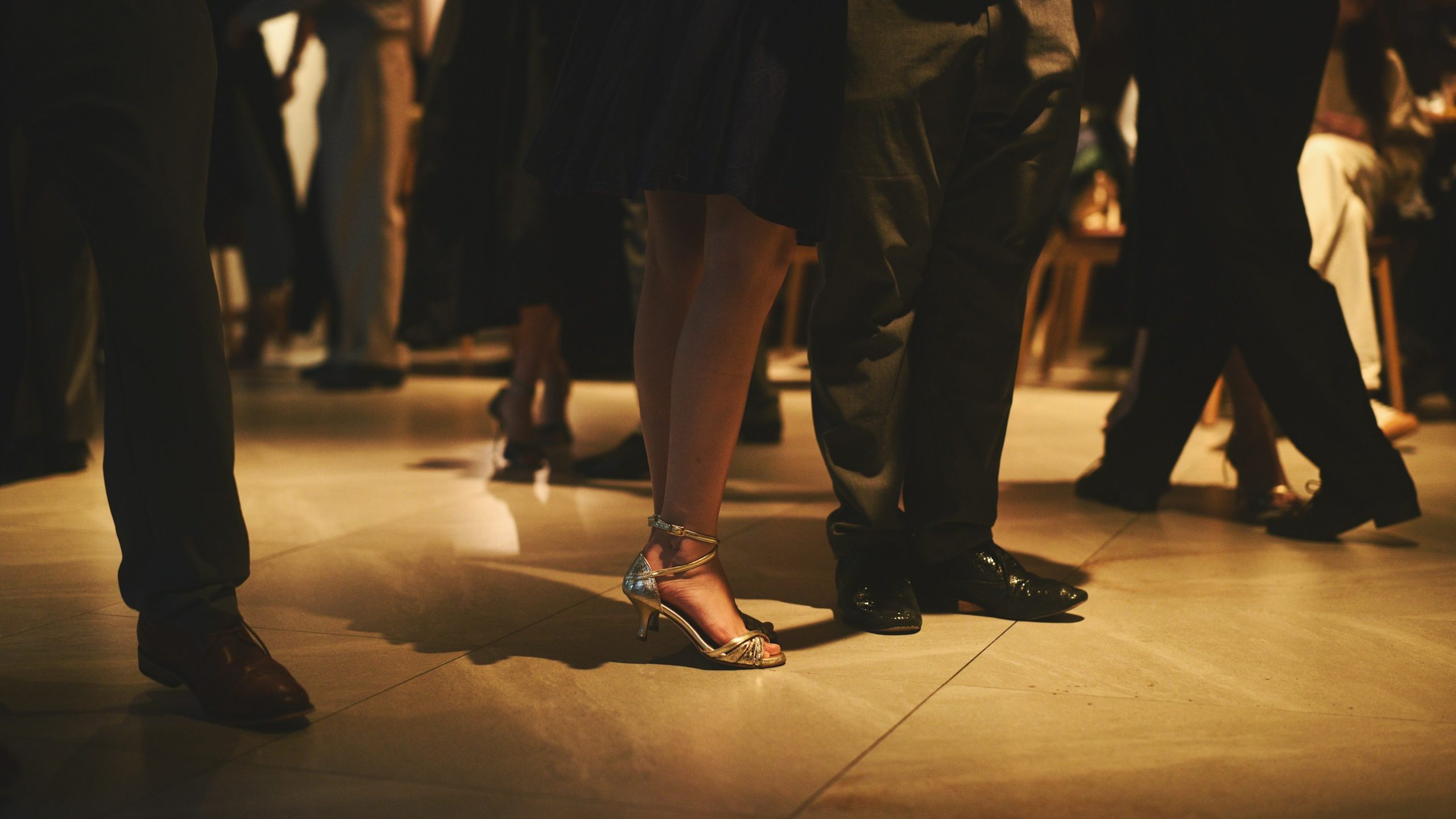 Elegant shoes and movement at a formal dance event
