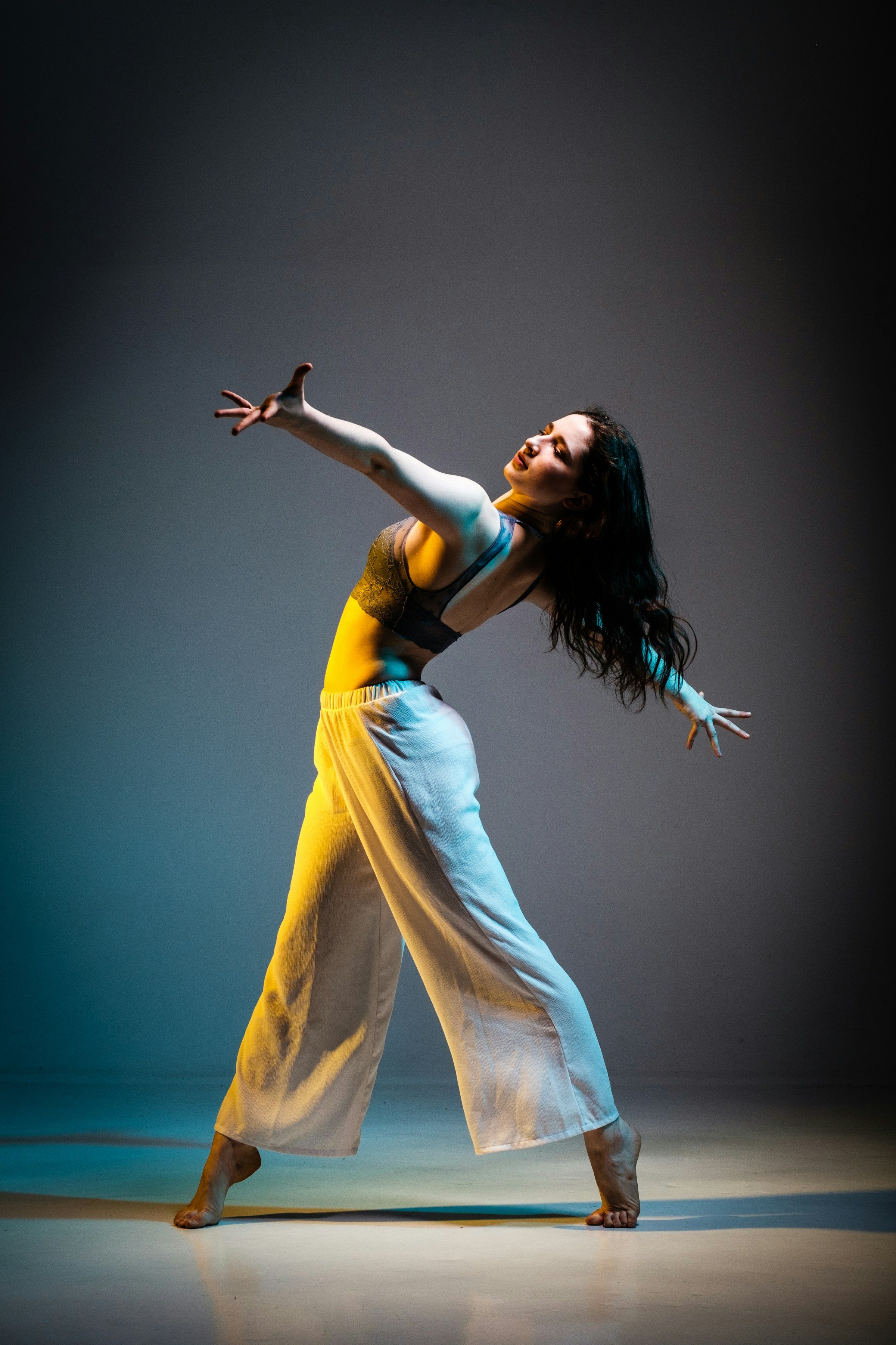 A hip-hop dancer moving in an urban setting