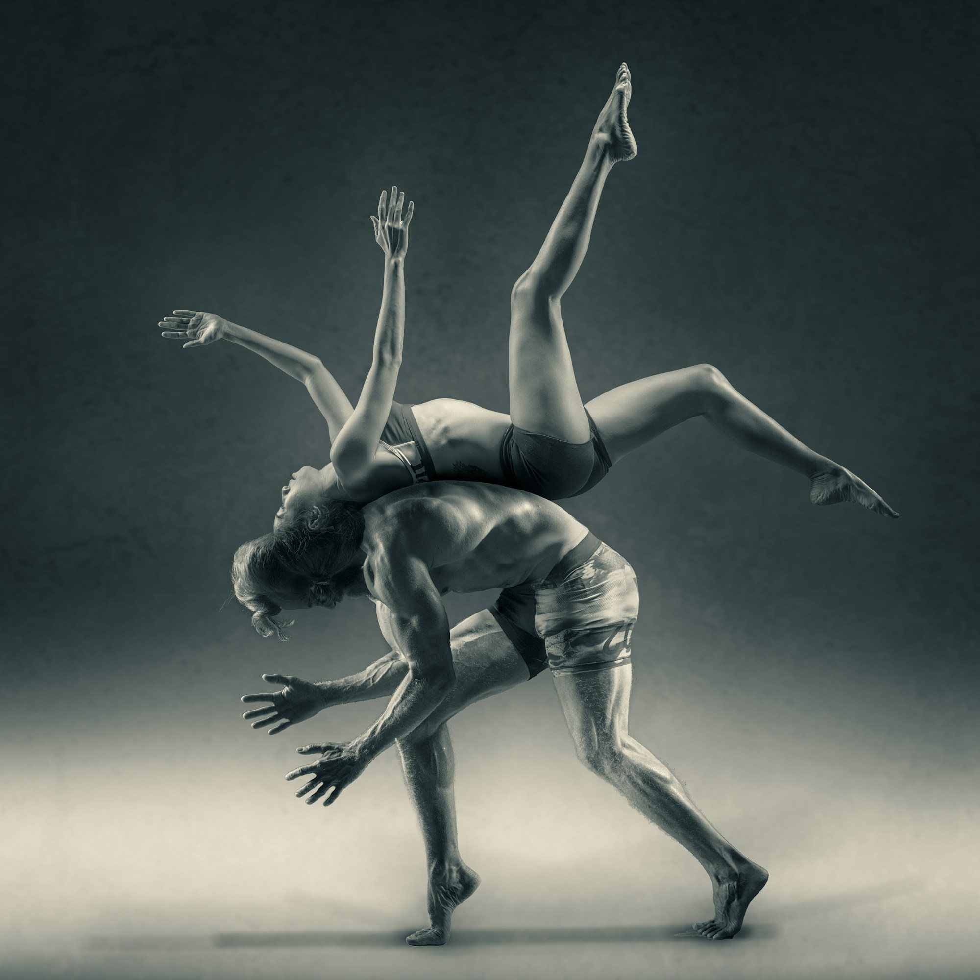 Two dancers creating a dynamic lift